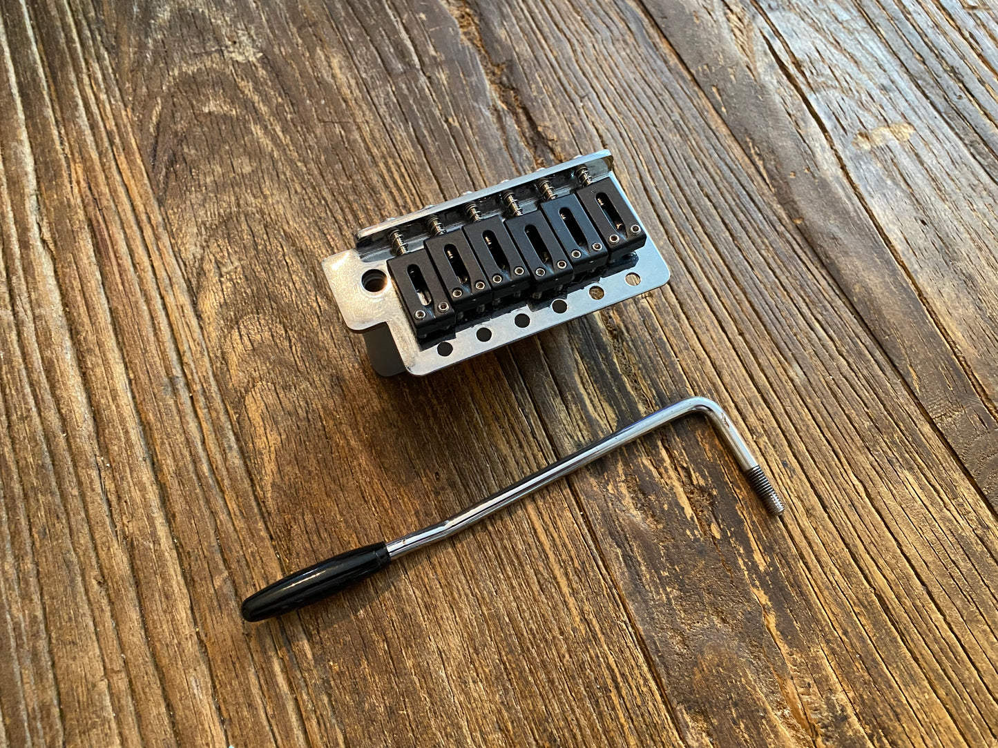 Stratocaster Style Tremolo Bridge | Chrome w/ Black Saddles, 2-1/16 Mounting Spacing, 2-3/32 Screw Spacing